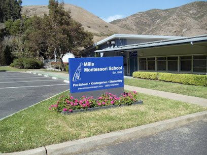 The Mills Montessori School sign on Hillside Boulevard, reading Pre-School, Kindergarten and Elementary